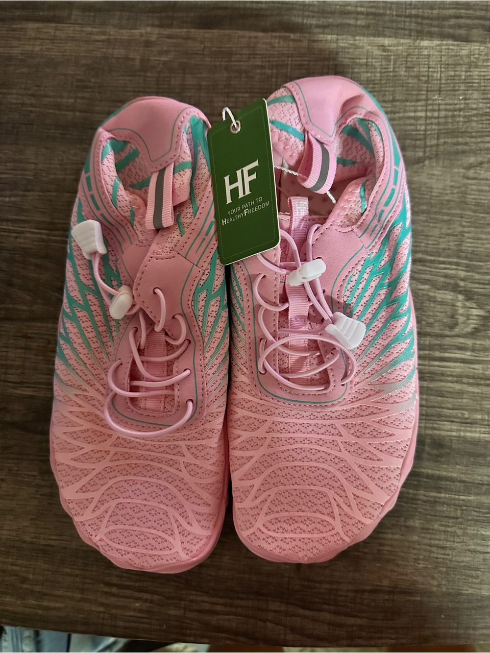 Pink Athletic barefoot Shoes with Teal Accents from Hike Footwear.